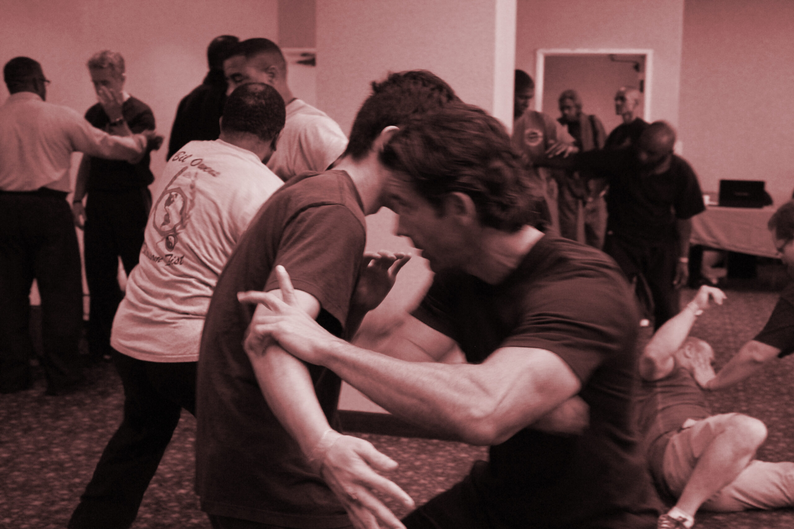 Photo of two men practicing martial art combative skills.